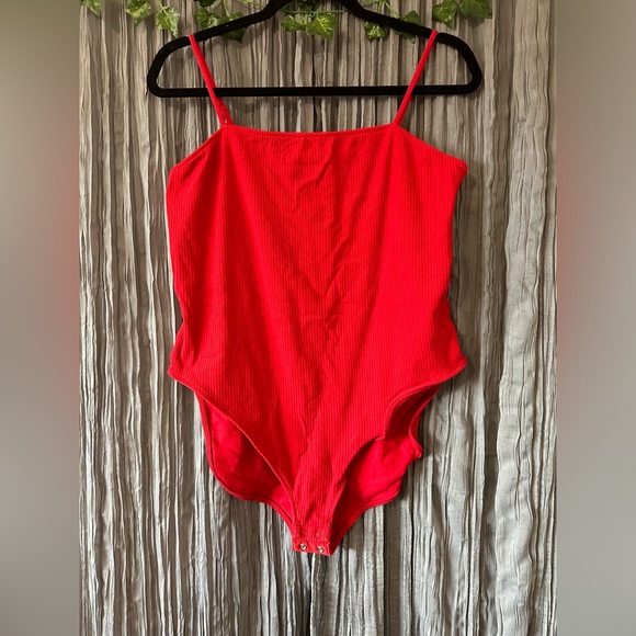 Red ribbed body suit with adjustable buttons on the bottom - Picture 1 of 3